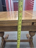 measuring tape showing table height approx 30 in