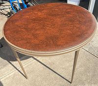 Full view of folding table showing laminate top and metal legs