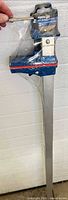 Full view of aluminum bar clamp in plastic wrap