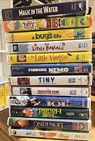 Stack of eleven VHS tapes showing all spines