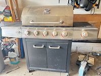 Front view of Backyard Grill 6-burner propane gas grill with cabinet base