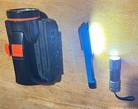 All three lights side by side: spotlight, pen light, flashlight