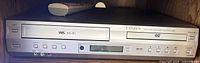 Front view of Citizen C504DVC combo player with remote on top