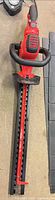 Full view of Craftsman hedge trimmer showing handles, body and blade sheath