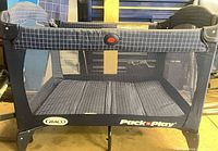 Full view of navy Graco Pack 'n Play