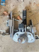 Hitch head, ball, spring bar brackets visible
