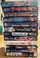 Stack of all 12 VHS tapes showing spines and titles
