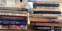 Two stacks of paperback books showing spines and titles