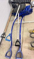 All three shovels laid out showing handles and blades