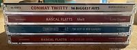 Spines of all four CDs showing titles
