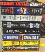 First stack showing eight paperback spines