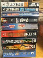 Full stack of nine books showing spines