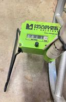 Close-up of green odometer housing showing Measure Master branding and meter readout