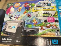 Retail box showing Mario & Luigi Deluxe Set 32 GB