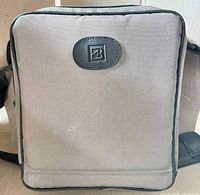 Gray camera bag front with B logo