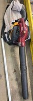 Full view of blower with tube and collection bag