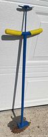 Full view of edger showing shaft, handle, and blade