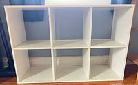 Front view of six-cube white organizer shelf