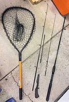 Landing net, disassembled rods laid out for full view