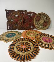 Group shot of all seven woven straw trivets
