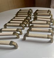 Full group of cabinet pulls arranged in rows