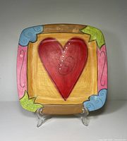 Front view of square platter with red heart motif