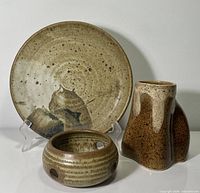 Front view of plate, mug and tealight holder together