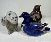 Group shot of three ceramic animal figurines