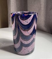 Full view of vase showing cylindrical shape and swirl coloration