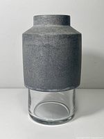 Front view of concrete and glass Willmann vase
