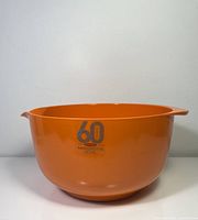 Front view showing orange bowl and 60th anniversary graphic