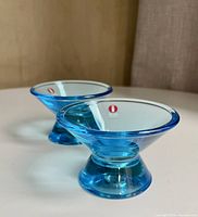 Two blue Kartio candleholders side view