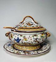 Full view of tureen with lid on underplate
