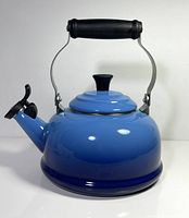 Full left profile of kettle showing body, handle and lid