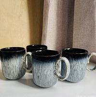 Five Denby Halo mugs side by side showing overall appearance