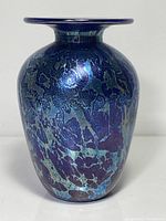Full view of iridescent glass vase front