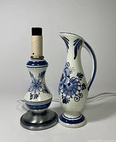 lamp and pitcher vase side by side
