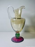 Full profile of pitcher showing complete form and colour segments