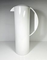 Full side view of white cylindrical pitcher