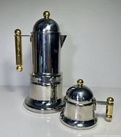 espresso maker and covered sugar bowl front view