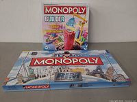 Both Monopoly game boxes front view