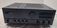 Front angled view of Onkyo A-8800 amplifier showing overall condition and controls