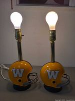 Both helmet lamps lit with bulbs showing full view