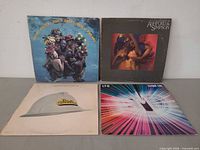 All four LP covers arranged together