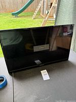 Front view of Element TV powered off on tabletop