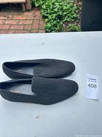 Top view of both loafers showing studded fabric and ALDO insole branding
