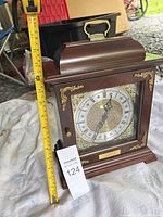 Front view of Bradford Clocks mantel clock with tape measure indicating height