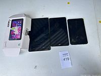 Front view of three tablets and Supersonic box