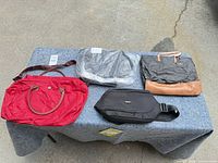 Group shot of four assorted bags on table
