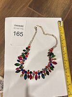 Full view of necklace with measuring tape showing size